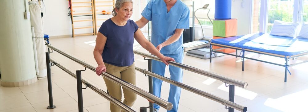 woman working on balance with physical therapist